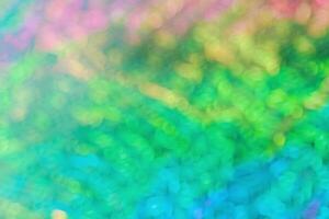 Defocused abstract background blurred bokeh yellow, blue, green, magenta, purple colors. Optical blur at sunlight, texture pattern gradient color. Blur wallpaper, fon, backdrop, design photo