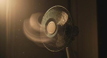 Dusty Room Electric Fan Blade Spinning at a High Speed in motion photo