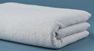 A Stack of Soft Fluffy White Bath Towels Ready for Use photo