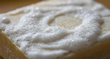A CloseUp View of a Soapy Bar Covered in Luxurious Lather photo