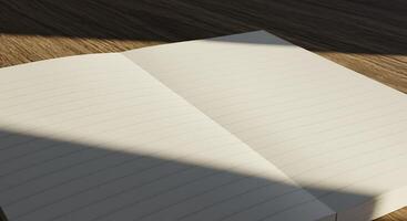 A Blank Open Notebook Resting on a Wooden Surface Bathed in Sunlight photo