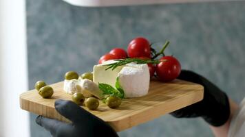 Camembert, Cooking process, Step by step worker at a craft cheese factory turns over cheese blanks production soft cheese video