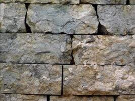 A close up of a stone wall with many different types of rocks video