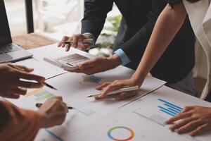 Business people working on a project at a table photo
