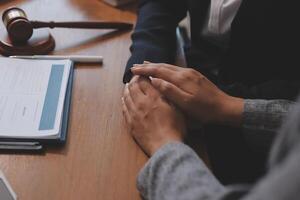 A lawyer and a client at a table photo