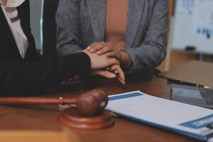 Two business people shaking hands in a courtroom photo