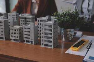 A group of people working on a building model photo