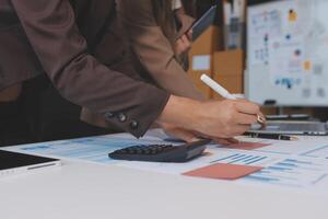 Business people working on a project at a desk photo