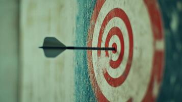 A black arrow is shot through a red circle. The circle is on a wall. The arrow is pointing to the right photo