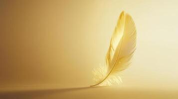 A single golden feather stands upright on a smooth surface, illuminated by soft lighting, casting gentle shadows on a minimalist background. photo