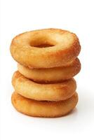 A delightful stack of freshly made donuts rests against a clean, white background. These golden treats promise a soft and fluffy texture, perfect for any dessert lover. photo
