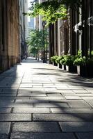 A serene city street bathed in sunlight, showcasing modern architecture and lush greenery, creating a peaceful urban environment. photo