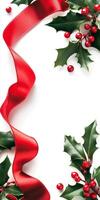 Red ribbon is wrapped around a white background with red berries. Concept of festivity and joy, as the ribbon photo