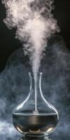 A stylish glass diffuser releasing aromatic steam, perfect for illustrating relaxation, wellness, and home decor themes. photo