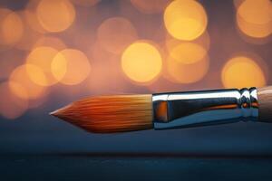 A detailed image of a paintbrush against a blurred bokeh background, perfect for art and creativity themes. photo