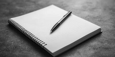 Explore Creativity with a Blank Notebook and Pen for Ideas and Reflection photo