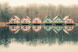 Colorful Cabins on a Serene Lake photo