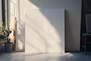 A blank canvas in an artist's studio, illuminated by natural sunlight, casting shadows on the wall and floor. photo