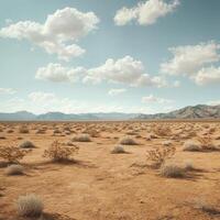 A vast desert scene featuring scattered shrubs, distant mountains, and a sky filled with fluffy clouds. photo