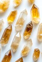 High-resolution image of citrine crystals arranged on a white background, highlighting their natural beauty and geometric shapes. photo