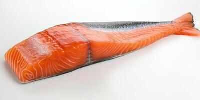 A piece of salmon is shown on a white background. The salmon is cut in half and has a black and white pattern photo