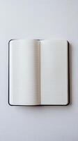 Open blank notebook with lined pages on a white background, perfect for writing, journaling, and creativity concepts. photo