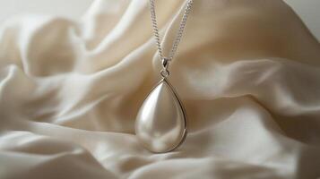 A stunning pearl pendant necklace displayed on smooth silk fabric, showcasing elegance and luxury in soft lighting. photo