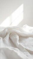 Soft White Fabric Draped with Gentle Shadows and Natural Light photo