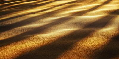 Sunlit patterns on golden sand dunes create a tranquil desert landscape, capturing the beauty of nature. photo