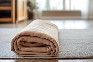 Cozy Beige Blanket Rolled on Soft Carpet in Sunlit Modern Living Room with Minimalist Decor photo