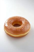 Glazed Doughnut with Sugar Sprinkles on White Background photo