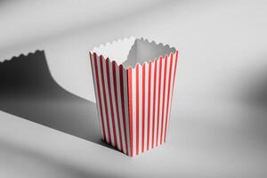 Classic Red and White Striped Popcorn Box on Minimal Background photo
