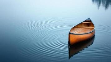 Serene Wooden Canoe Floating on Calm Lake with Gentle Ripples photo