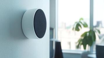 Modern white speaker mounted on wall in contemporary office setting photo