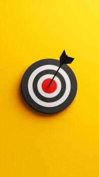 A black and white target with a red bullseye and a black arrow pointing to it photo