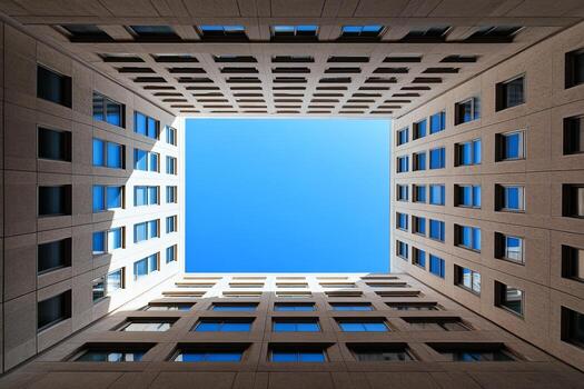 Modern Urban Architecture with Symmetrical Building Facades and Clear Blue Sky photo