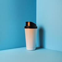 Minimalist White Travel Mug Against a Vibrant Blue Background in a Modern Studio Setting photo