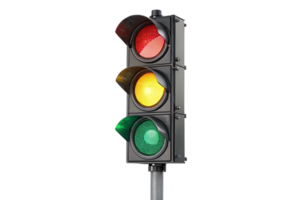 A modern traffic light, angled slightly, showcases all three lights red, yellow, and green encased in a dark housing, symbolizing regulated movement png