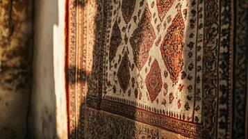 A rug is hanging on a wall photo
