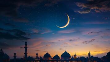 The moon and crescent are seen in the sky over a mosque photo