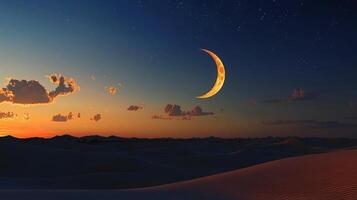 The crescent moon is seen in the sky over a desert photo
