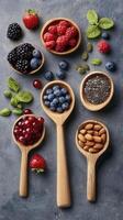 Colorful Berry and Nut Assortment on Rustic Background photo