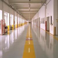 Long Industrial Corridor with Polished Floor and Yellow Lines photo
