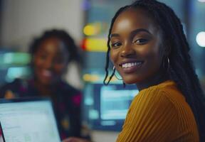 Empowering Innovation A Vibrant Image Showcasing a Confident Black Woman with Radiant Skin, Smiling Genuinely in a Modern Office Setting, Collaborating with Colleagues on Technological Advancements photo