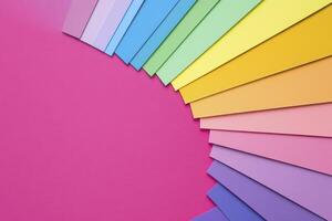 Explore a vibrant spectrum of colors with this captivating image showcasing a beautiful arrangement of pastel paper sheets Perfect for designers, artists, and anyone seeking visual inspiration This photo