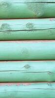 Explore the captivating charm of this close-up photograph, revealing a meticulously crafted wooden log wall painted in a serene shade of green, offering a refreshing glimpse into rustic architecture photo