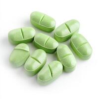 Explore the world of green oval tablets up close, revealing their intricate details against a clean white background Discover the significance of these small wonders, perfect for healthcare-related photo
