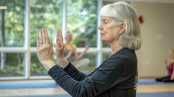 Embrace tranquility with gentle movements, as a serene woman participates in a rejuvenating Tai Chi session, guided by an experienced instructor, cultivating inner peace and physical well-being photo