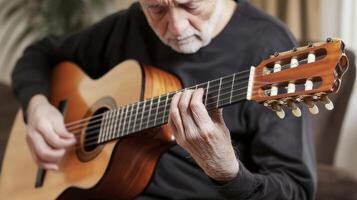 Experience the soul of music with this captivating image of a seasoned musician passionately playing the guitar, his fingers dancing across the fretboard as he creates melodies that resonate with photo