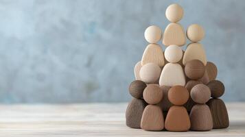 Wooden Figurines Depicting a Hierarchical Structure Understanding Team Dynamics, Leadership Roles, and Organizational Structure through Symbolic Representation Visualize Group Dynamics, Management photo